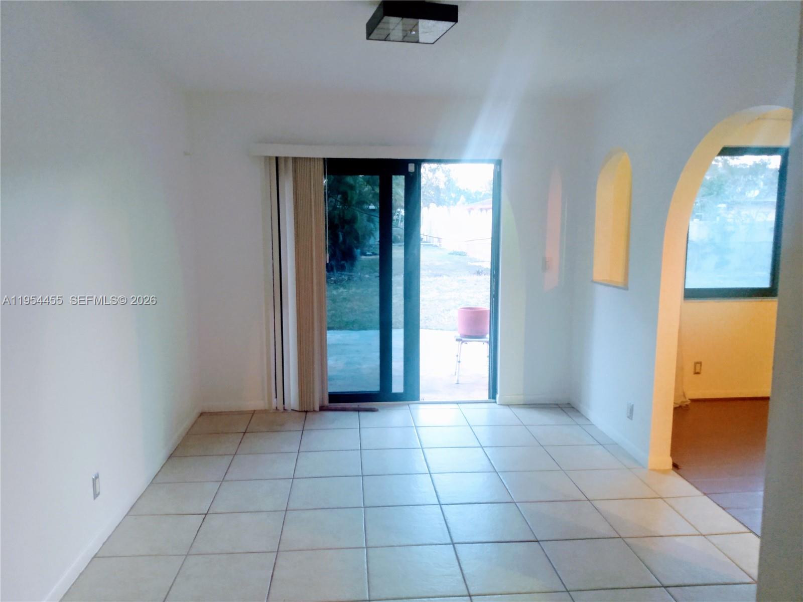 4411 Northwest 15th Street Lauderhill, FL 33313 - Photo 4 of 14 an empty room with windows