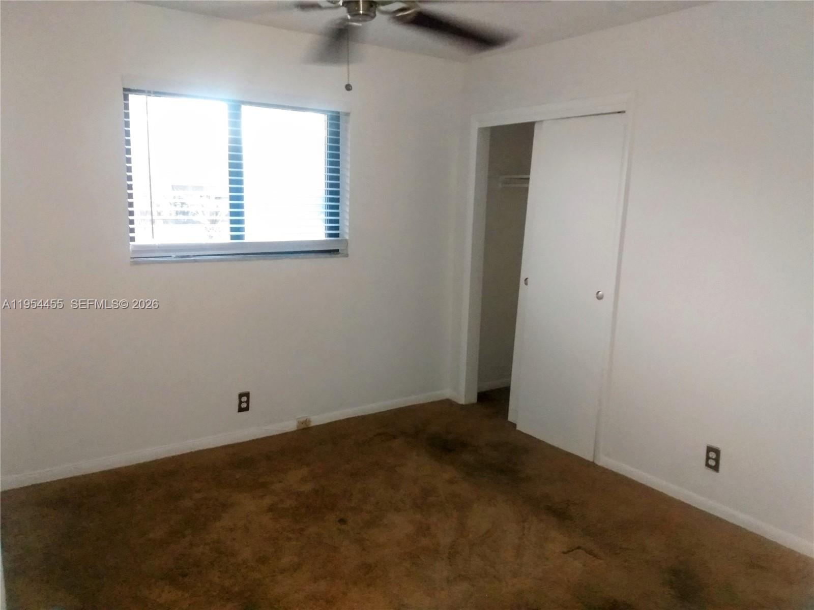 4411 Northwest 15th Street Lauderhill, FL 33313 - Photo 9 of 14 an empty room with a window