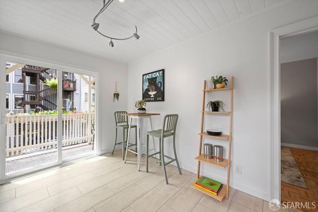 a kitchen with stainless steel appliances kitchen island granite countertop a sink a stove cabinets and a refrigerator