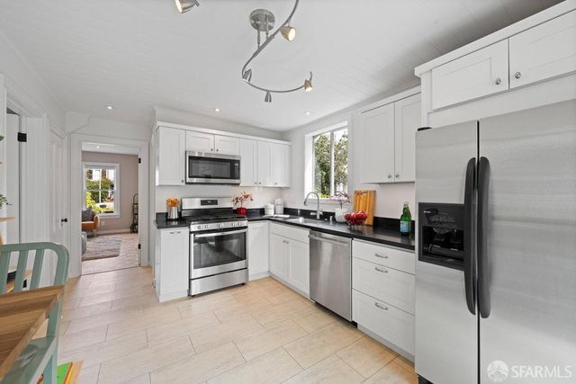 a bedroom with a bed and a cabinets