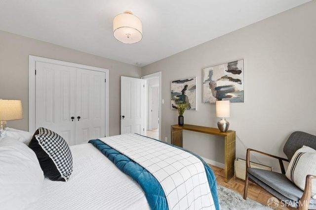 a bedroom with bed and a window