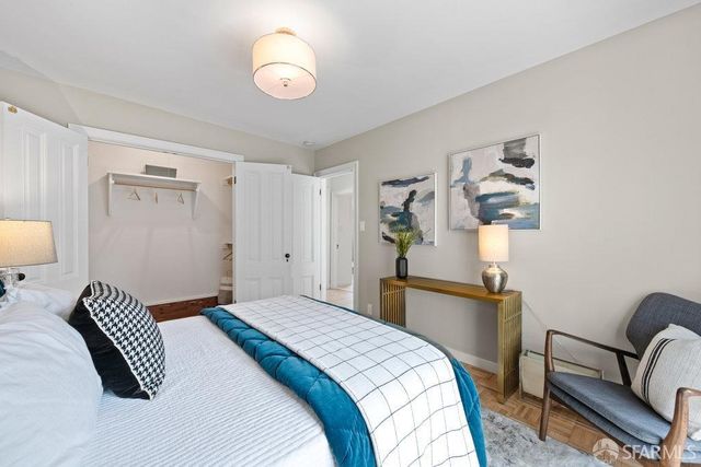 a bedroom with bed and a window