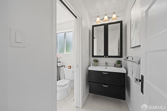 a white toilet sitting next to a bath tub shower