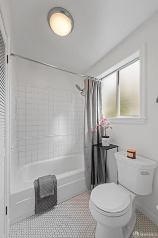 a view of a balcony with a potted plant
