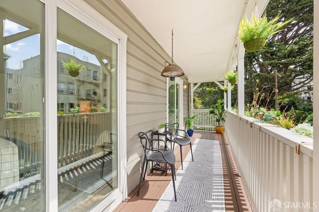 a view of balcony with a potted plant