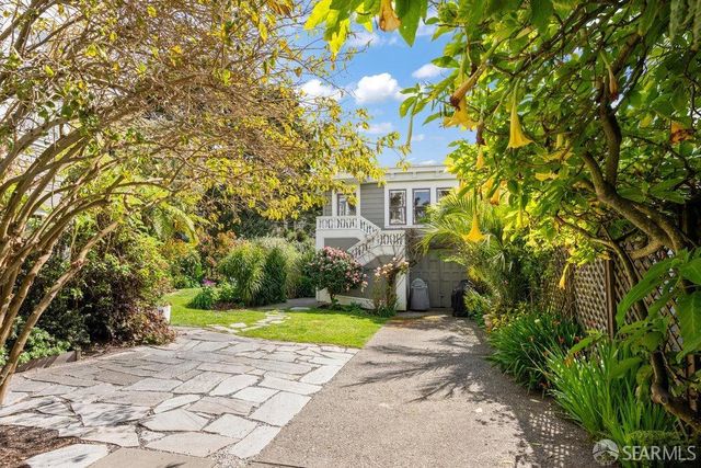 an aerial view of residential house with outdoor space and swimming pool