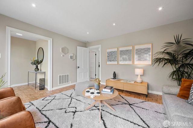 a kitchen with stainless steel appliances sink refrigerator and window
