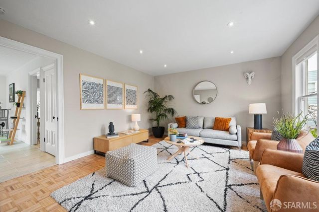 a view of a dining room with furniture and window