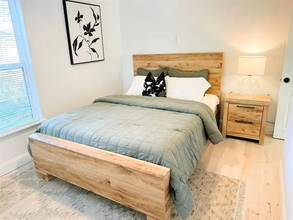 a bedroom with a bed and a couch