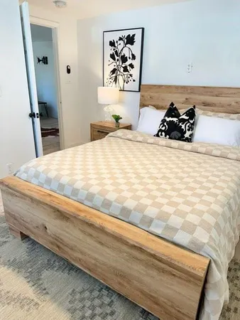a bedroom with a bed and dresser