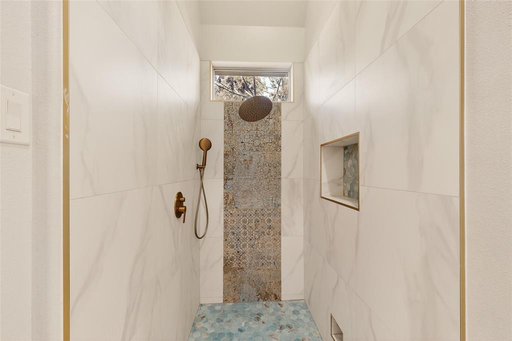 11048 Riney Court Frisco, TX 75035 - Photo 12 of 40 a bathroom with a shower