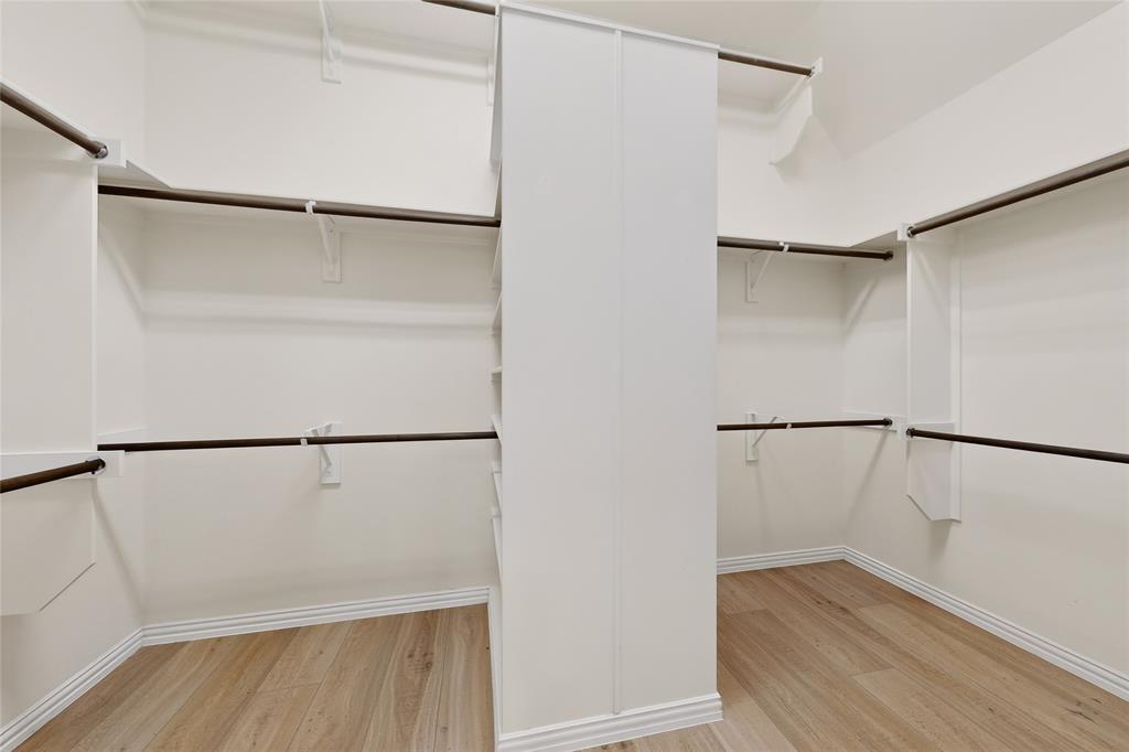 11048 Riney Court Frisco, TX 75035 - Photo 14 of 40 a view of an empty walk in closet