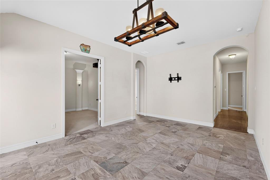 11048 Riney Court Frisco, TX 75035 - Photo 19 of 40 a view of a livingroom with wooden floor and staircase
