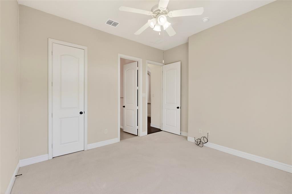 11048 Riney Court Frisco, TX 75035 - Photo 25 of 40 an empty room with a ceiling fan and a window