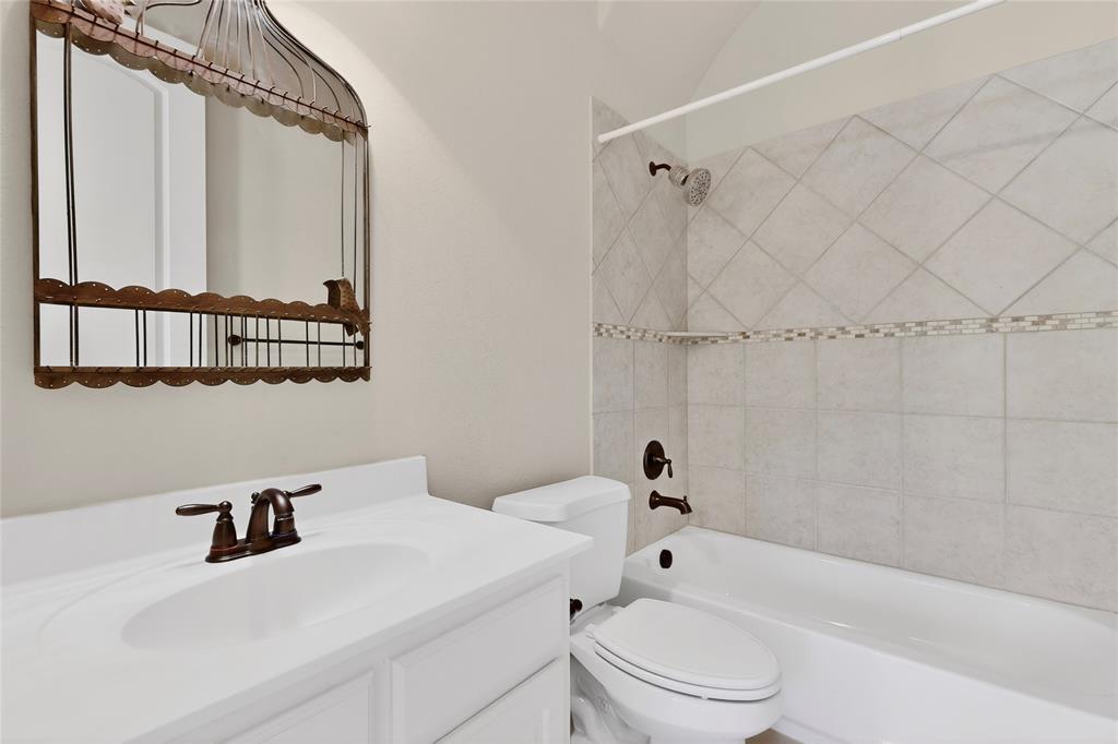 11048 Riney Court Frisco, TX 75035 - Photo 26 of 40 a bathroom with a sink a toilet and shower