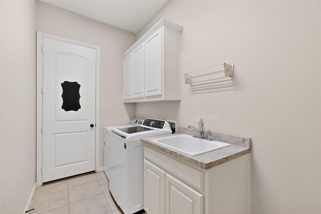 11048 Riney Court Frisco, TX 75035 - Photo 30 of 40 a utility room with sink dryer and washer