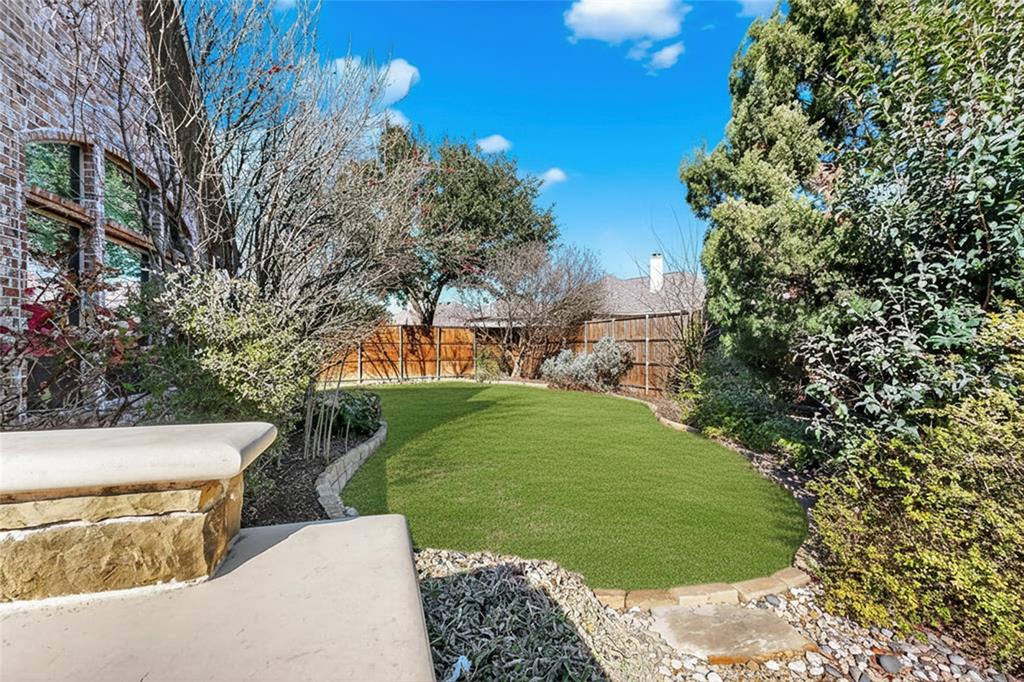 11048 Riney Court Frisco, TX 75035 - Photo 36 of 40 a view of a garden with a fountain