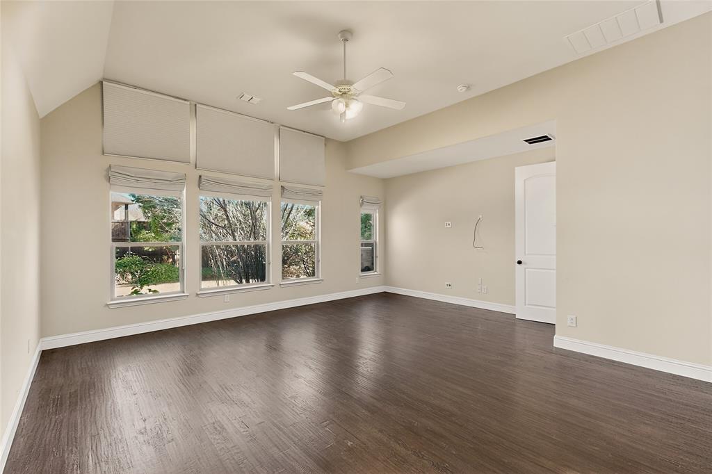 11048 Riney Court Frisco, TX 75035 - Photo 9 of 40 an empty room with wooden floor and windows