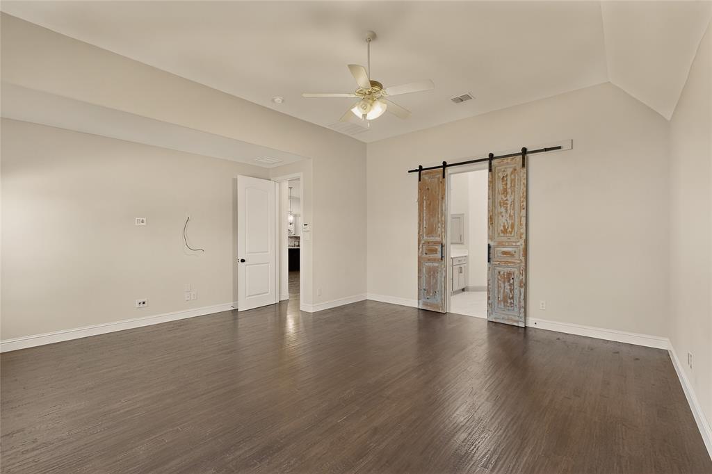 11048 Riney Court Frisco, TX 75035 - Photo 10 of 40 a view of an empty room with wooden floor