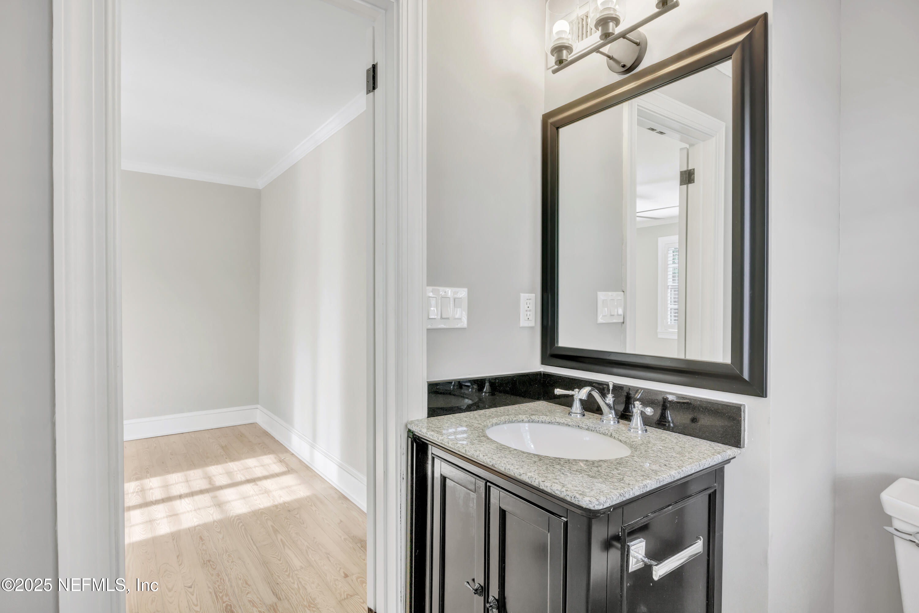 1210 Inwood Terrace Jacksonville, FL 32207 - Photo 35 of 48 a bathroom with a granite countertop sink and a mirror