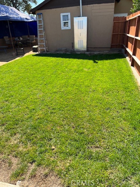 7563 Lincoln Avenue Riverside, CA 92504 - Photo 14 of 34 a backyard of a house with table and chairs