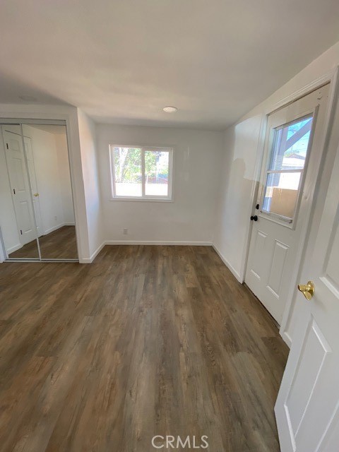 7563 Lincoln Avenue Riverside, CA 92504 - Photo 20 of 34 wooden floor in an empty room with a window