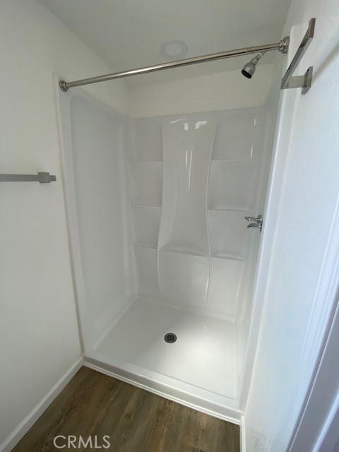 7563 Lincoln Avenue Riverside, CA 92504 - Photo 22 of 34 a bathroom with a glass shower door