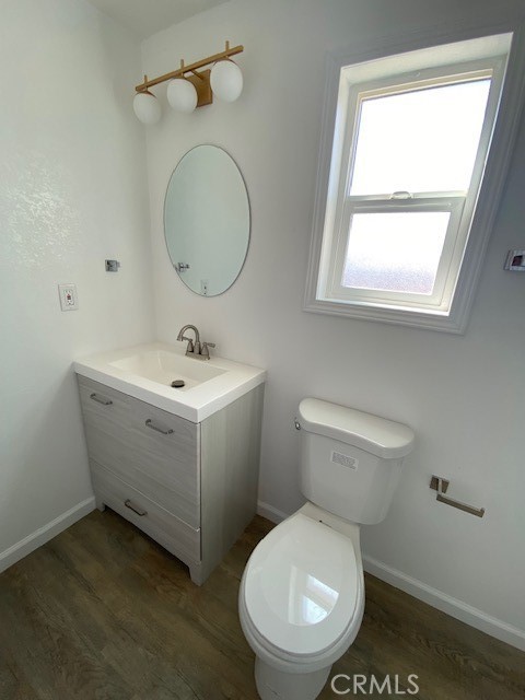 7563 Lincoln Avenue Riverside, CA 92504 - Photo 24 of 34 a bathroom with a toilet sink and mirror