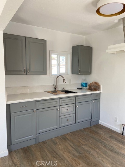 7563 Lincoln Avenue Riverside, CA 92504 - Photo 31 of 34 a kitchen with sink cabinets and window