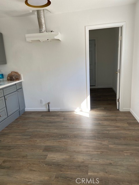 7563 Lincoln Avenue Riverside, CA 92504 - Photo 32 of 34 a view of a room with wooden floor and cabinet