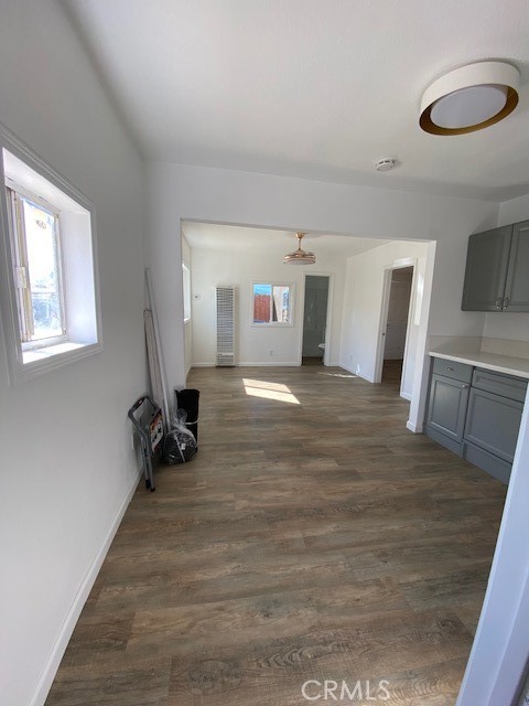 7563 Lincoln Avenue Riverside, CA 92504 - Photo 34 of 34 a view of a livingroom with wooden floor and a ceiling fan