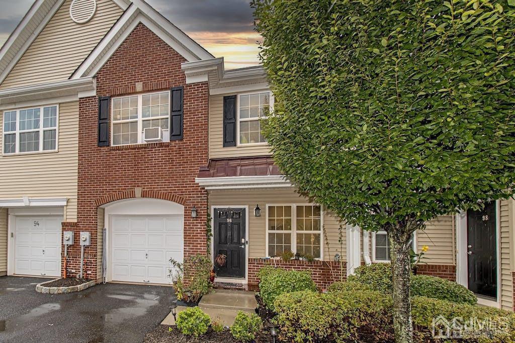 96 Andrews Way, Unit 96 Piscataway, NJ 08854 - Photo 1 of 26 a front view of a house with a garden