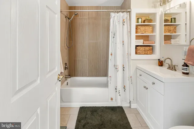 a living room with flat screen tv and a table