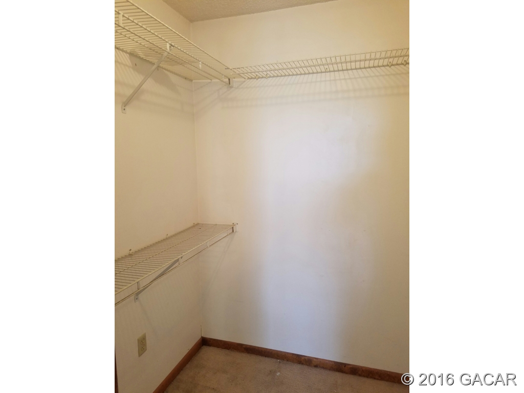 8130 Southwest 12th Place Gainesville, FL 32607 - Photo 6 of 23 Master Walk-in closet