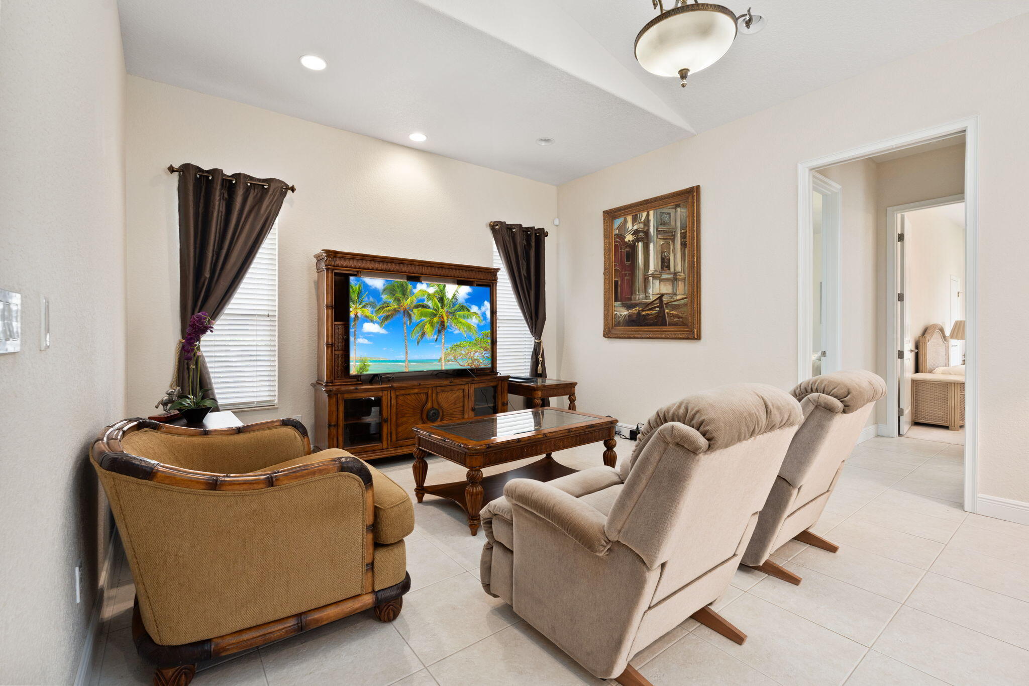 9523 Shadow Lane Fort Pierce, FL 34951 - Photo 16 of 32 a living room with furniture and a flat screen tv
