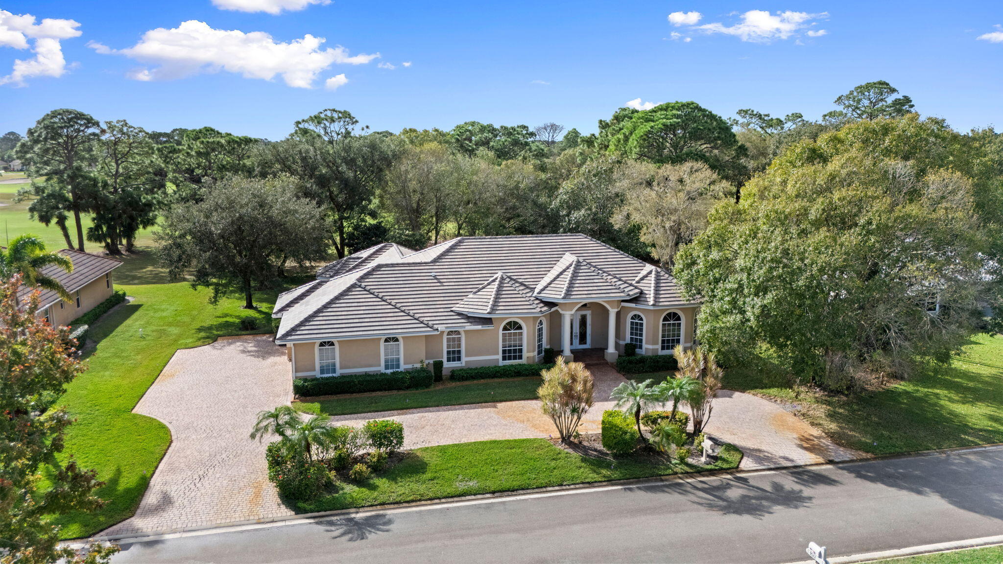9523 Shadow Lane Fort Pierce, FL 34951 - Photo 2 of 32 a front view of a house with garden