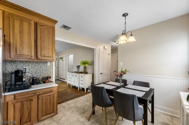 a kitchen with a table and chairs in it