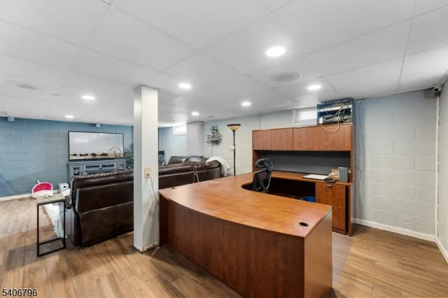 a kitchen with stainless steel appliances kitchen island granite countertop a stove and a refrigerator