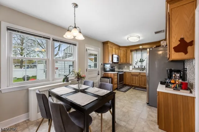 a view of a dining room with furniture window and outside view