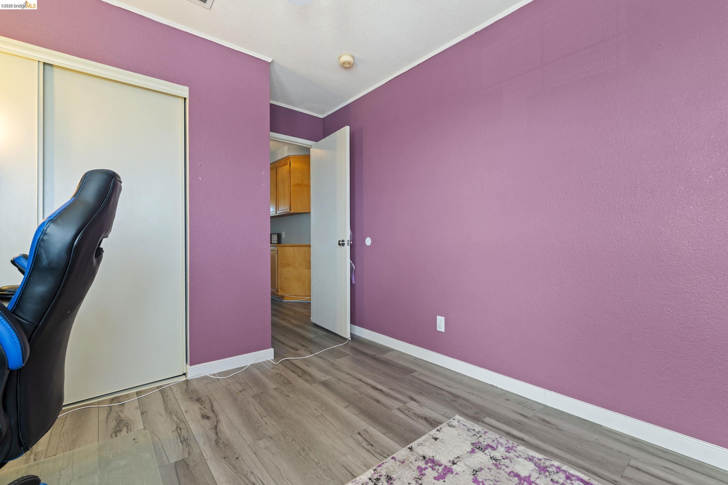 4924 Stirrup Way Antioch, CA 94531 - Photo 21 of 40 a view of empty room with wooden floor
