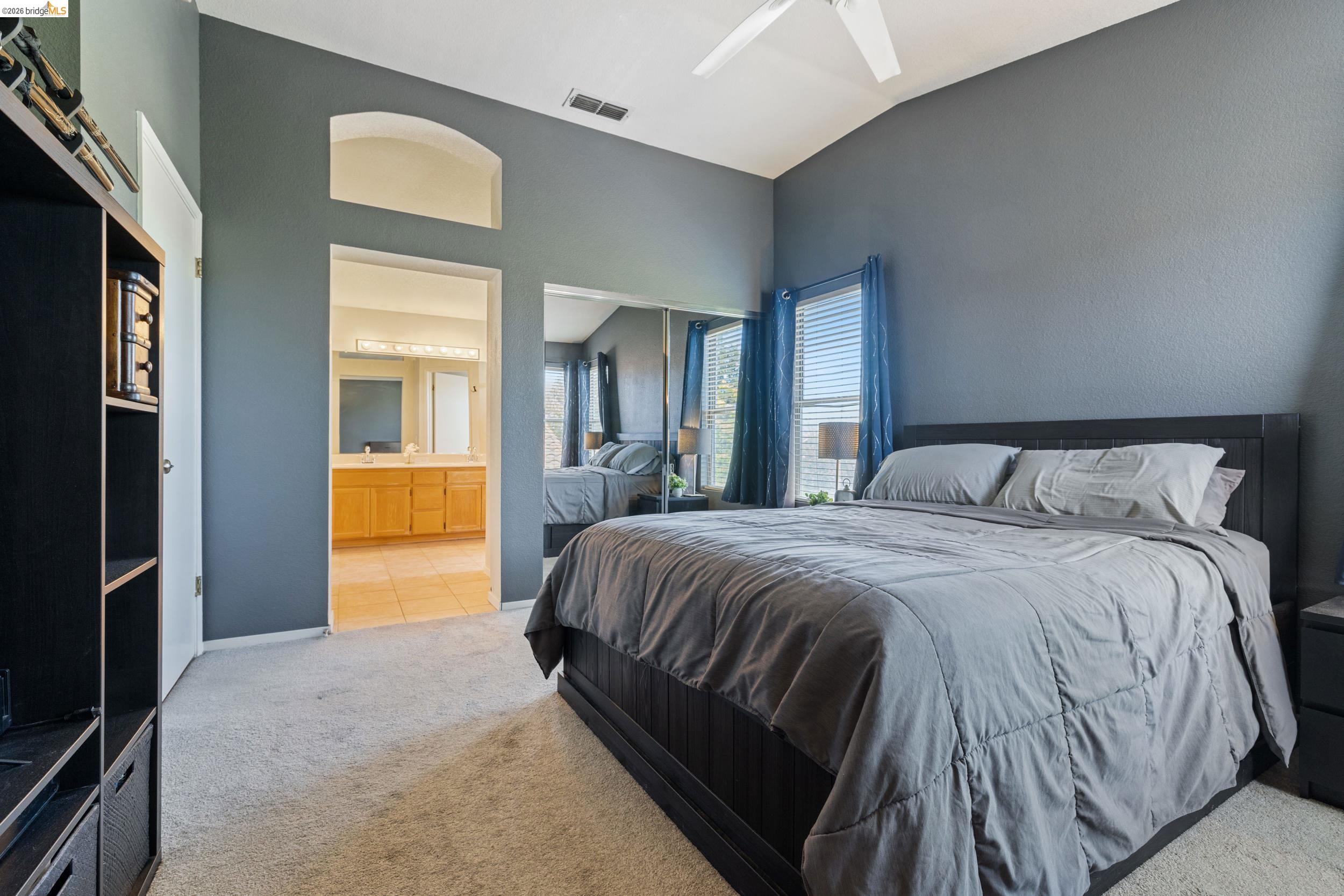 4924 Stirrup Way Antioch, CA 94531 - Photo 25 of 40 a bedroom with a bed and a view of bathroom