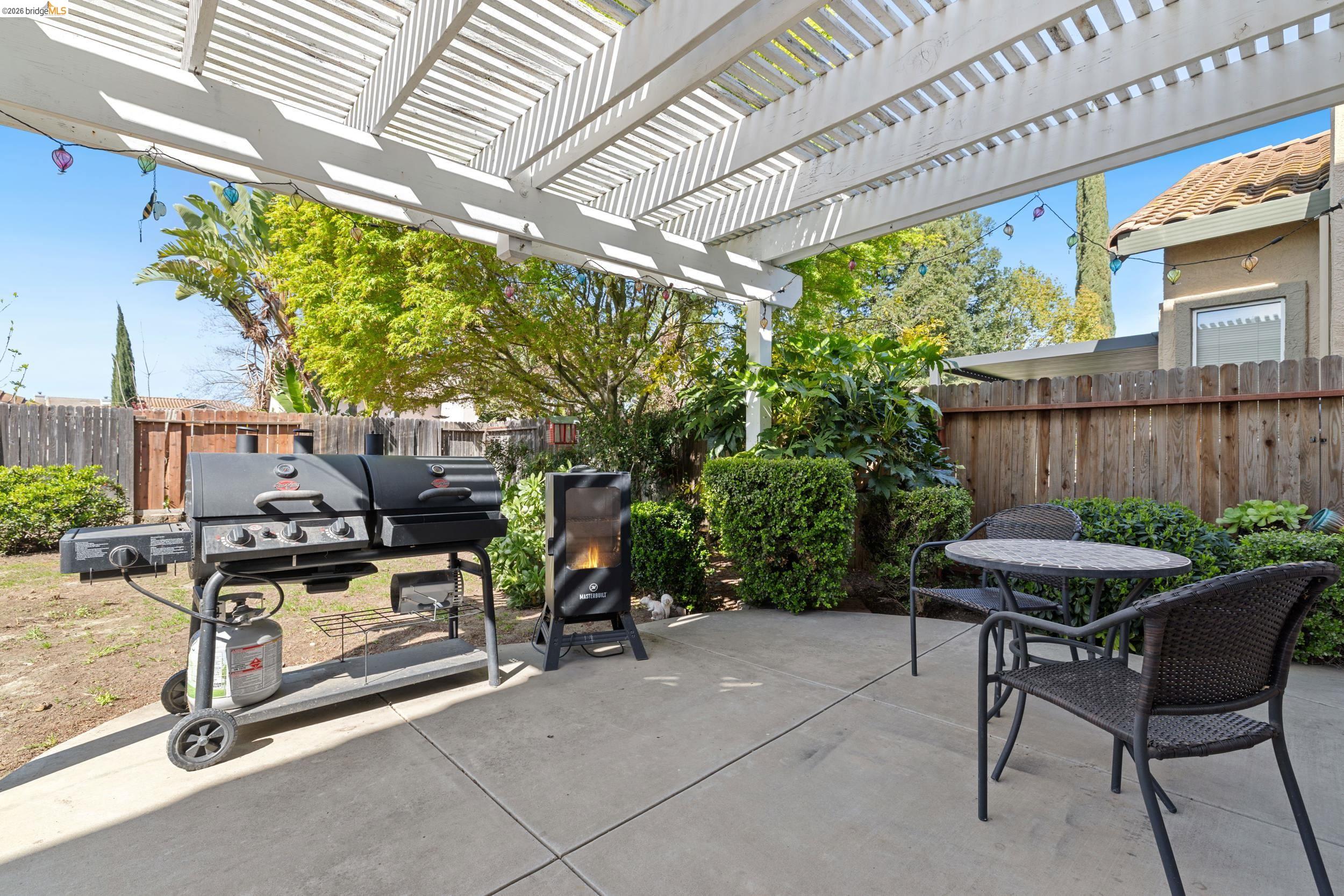 4924 Stirrup Way Antioch, CA 94531 - Photo 29 of 40 a view of a patio with table and chairs and potted plants