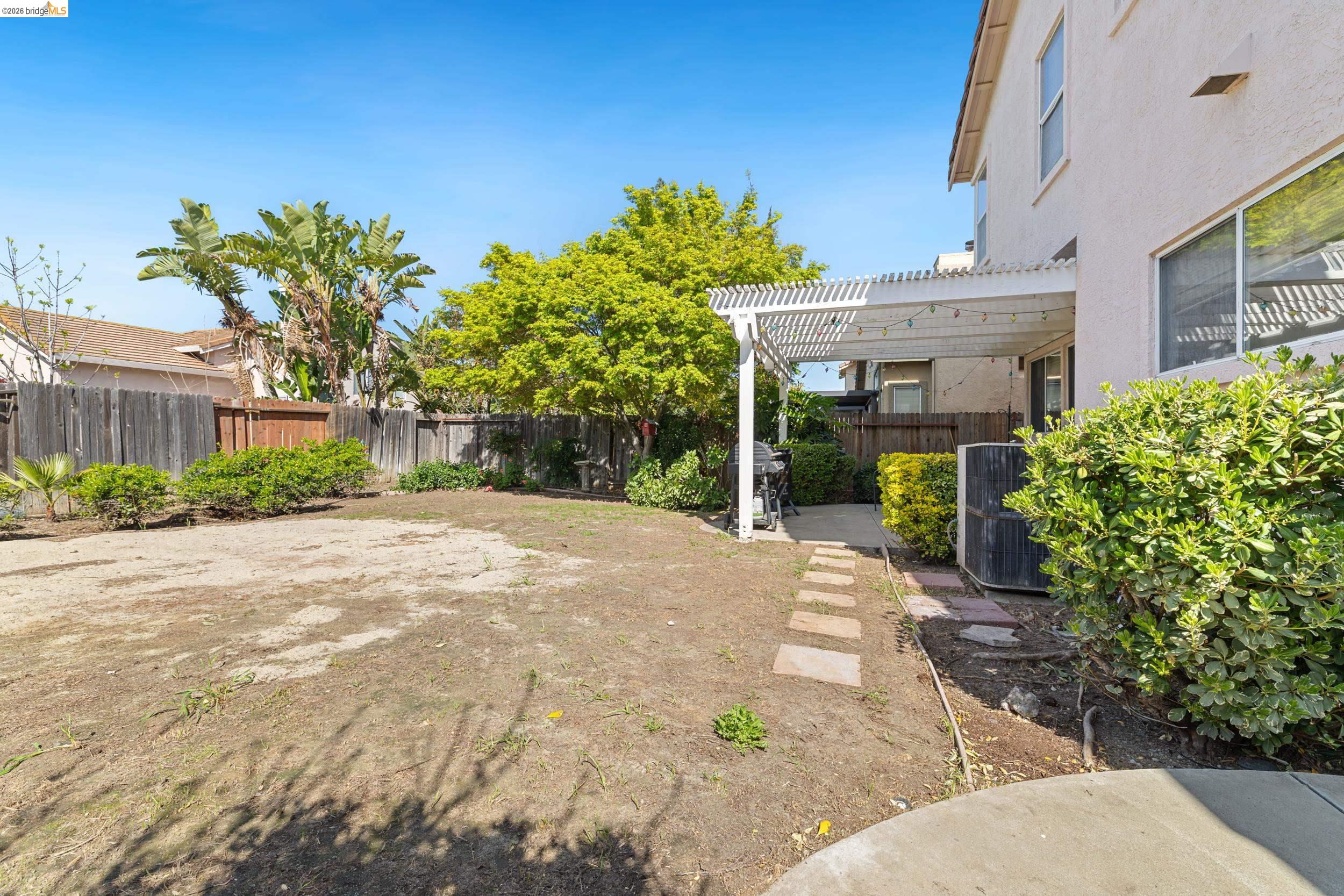 4924 Stirrup Way Antioch, CA 94531 - Photo 30 of 40 a view of a house with potted plants and a large tree