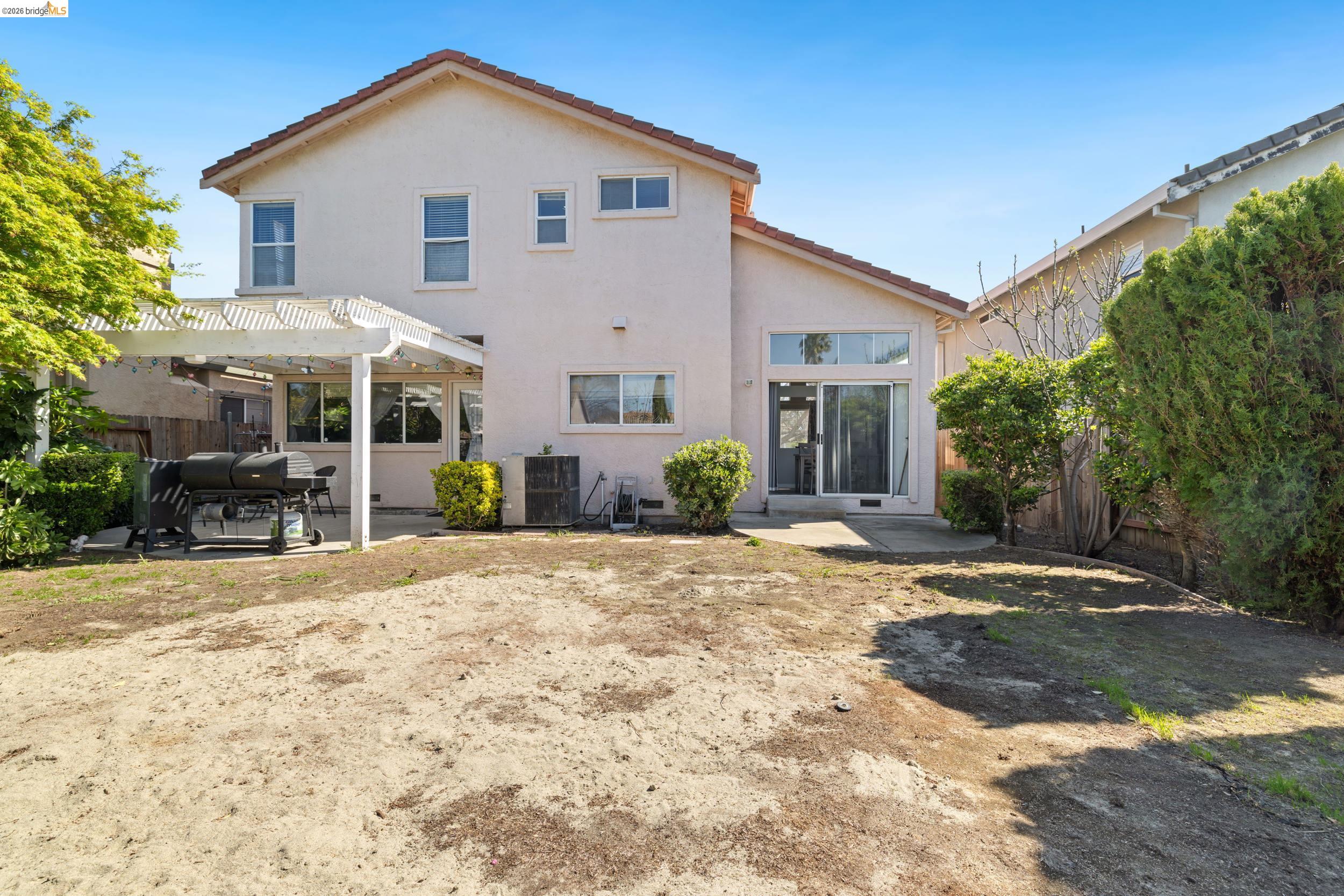 4924 Stirrup Way Antioch, CA 94531 - Photo 33 of 40 a view of a white house with a yard and large tree