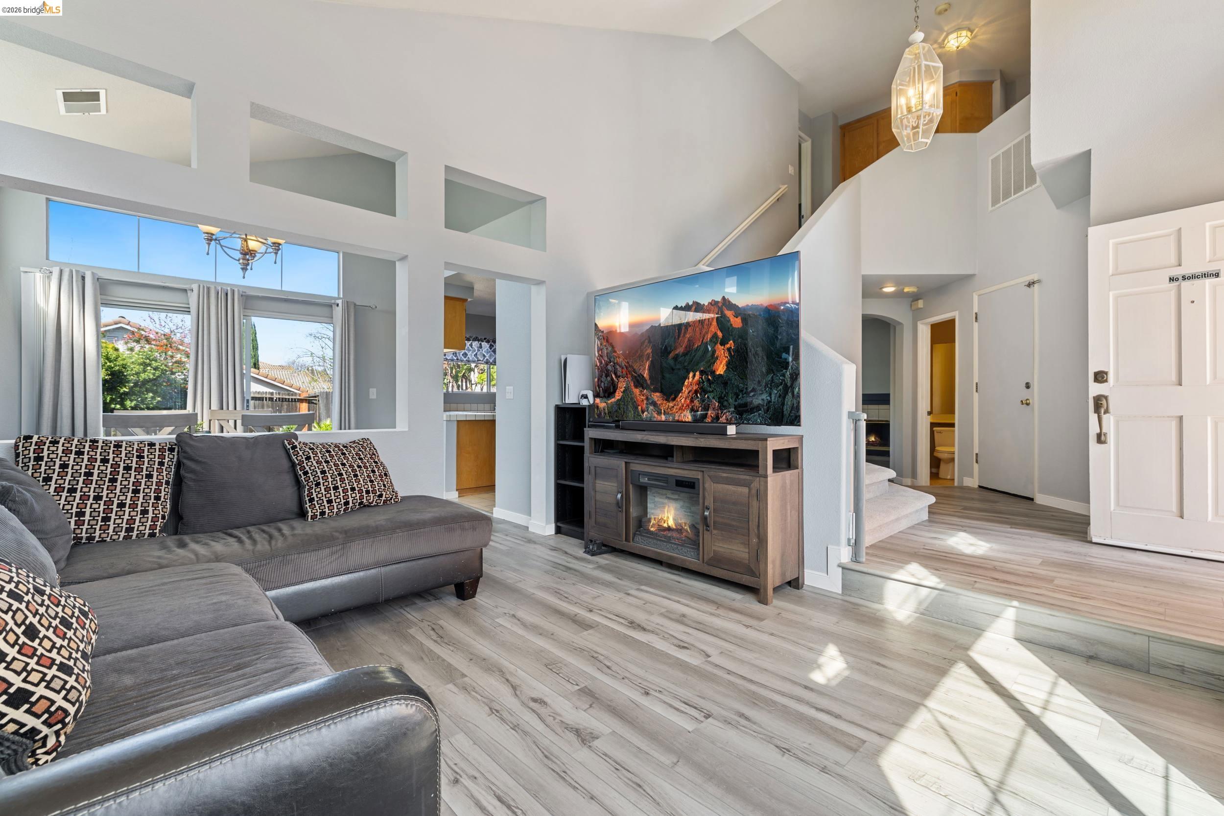 4924 Stirrup Way Antioch, CA 94531 - Photo 4 of 40 a living room with furniture and a fireplace