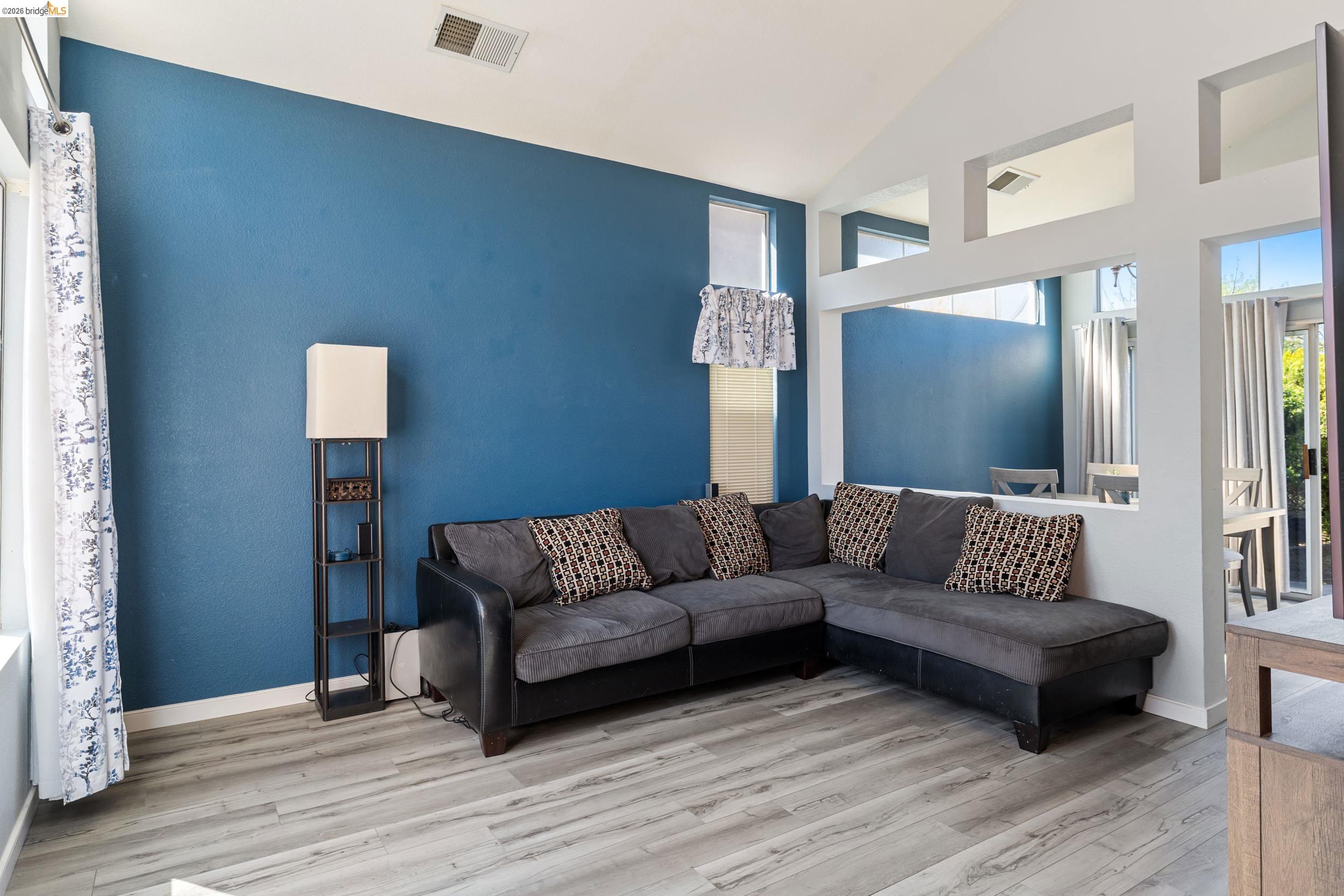 4924 Stirrup Way Antioch, CA 94531 - Photo 6 of 40 a living room with furniture and a wooden floor