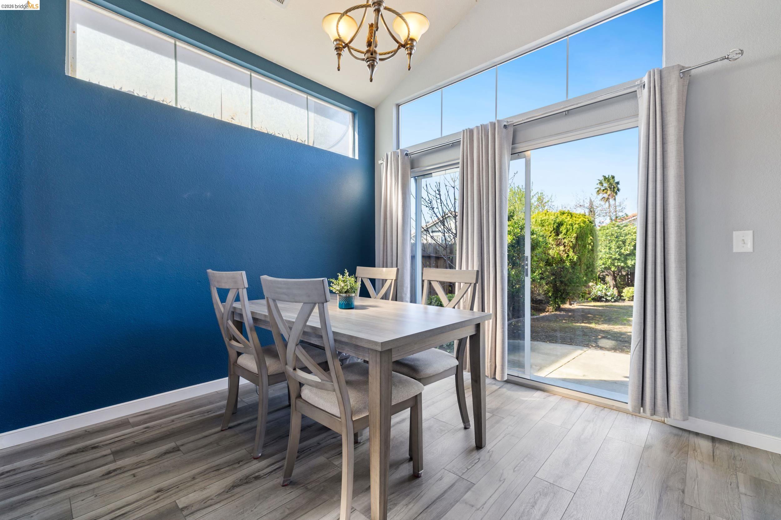4924 Stirrup Way Antioch, CA 94531 - Photo 8 of 40 a view of a dining room with furniture window and wooden floor