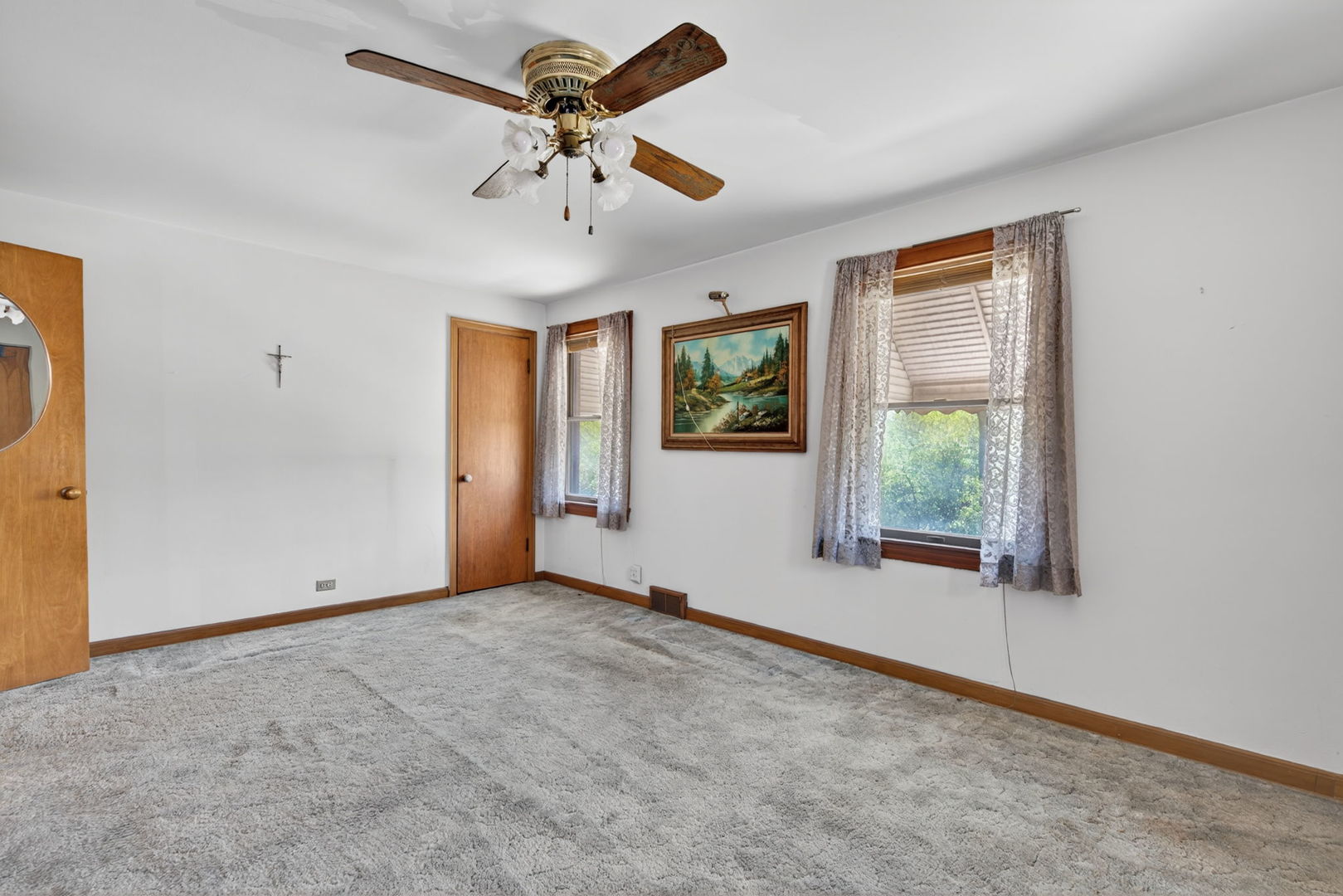 9020 West Forestview Drive North Riverside, IL 60546 - Photo 11 of 19 an empty room with windows and fan