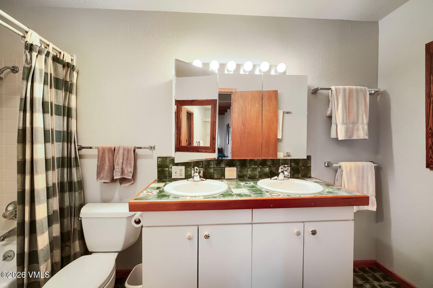 128 Beaver Road, Unit EAST Eagle-Vail, CO 81620 - Photo 17 of 21 a bathroom with a sink and a mirror