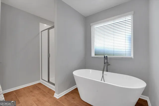 a white bath tub sitting in a bathroom